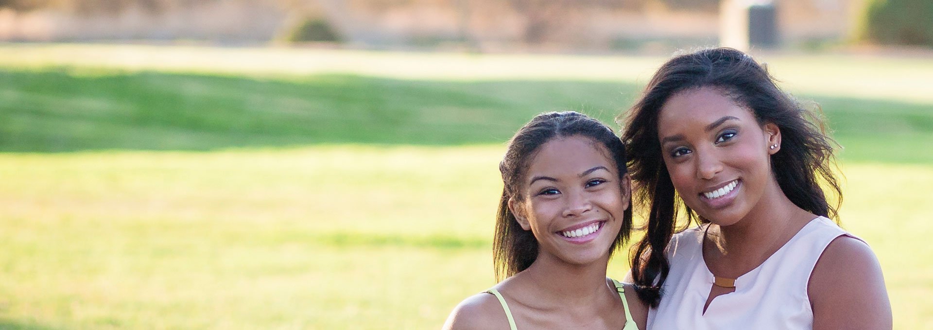Mother and dauther in an outdoor setting.